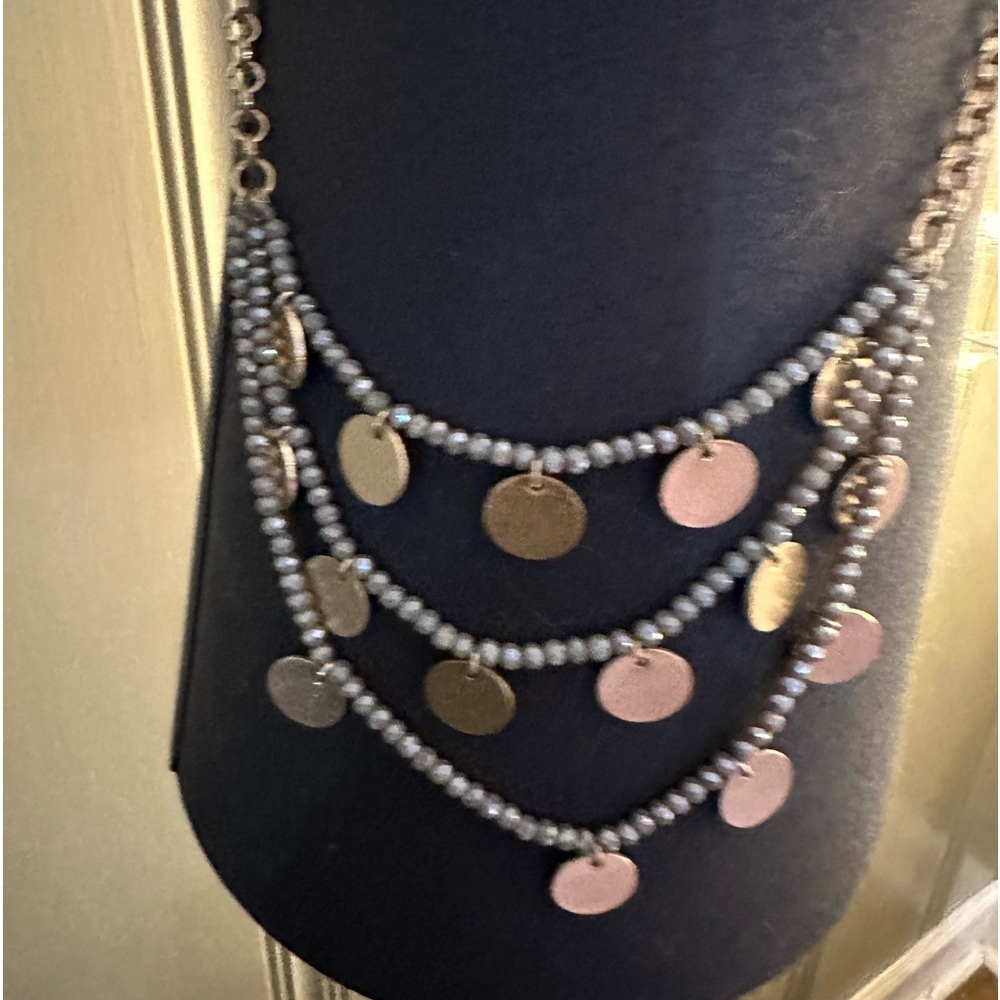Gold necklace with grey beading with gold disc